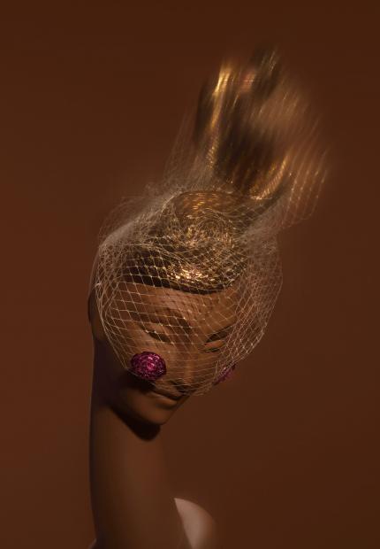 A straw cocktail beret with tulle and a straw spotted veil Stephen Jones Autumn Winter 2018 Crowns 07 Pat Cleveland